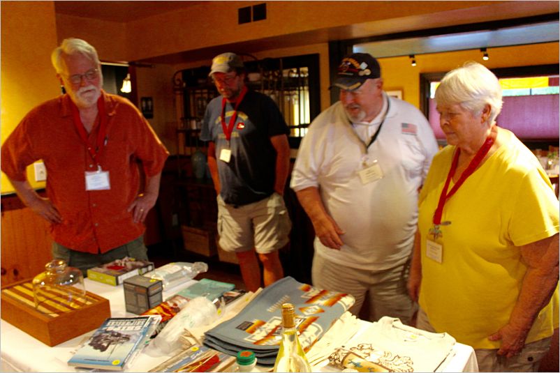 Display of auction items / Doug W, Scott Martin, and Max & Gayle Wernette